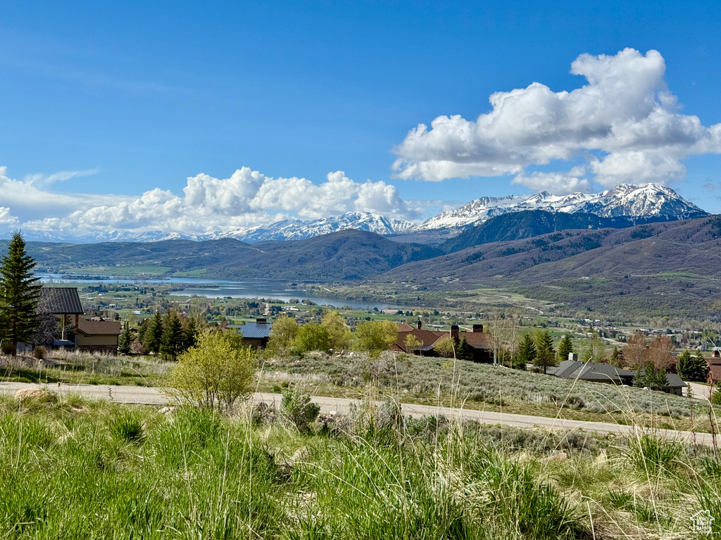 Property view of mountains featuring a water view
