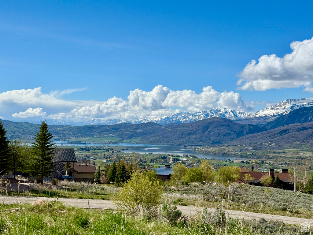 Property view of mountains featuring a water view