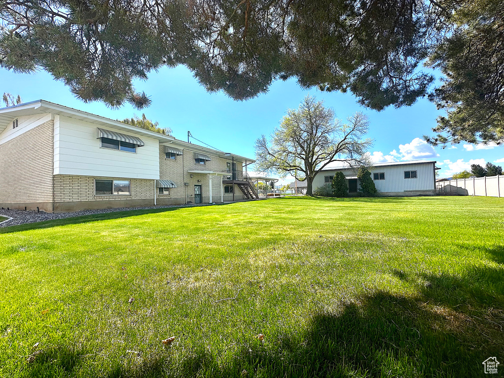 View of yard featuring fence