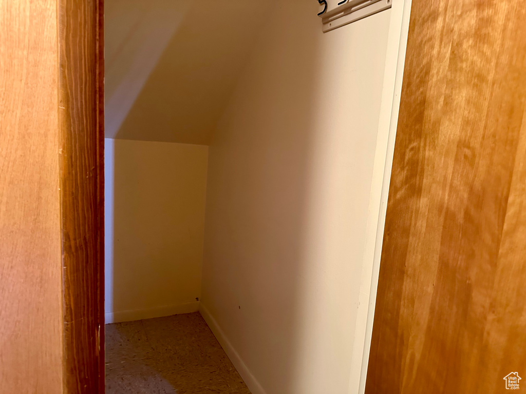 Bonus room with baseboards and lofted ceiling