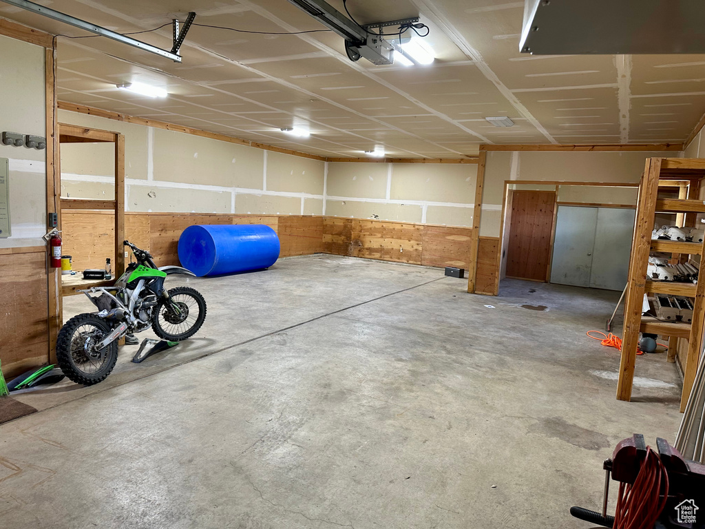 Garage featuring a garage door opener