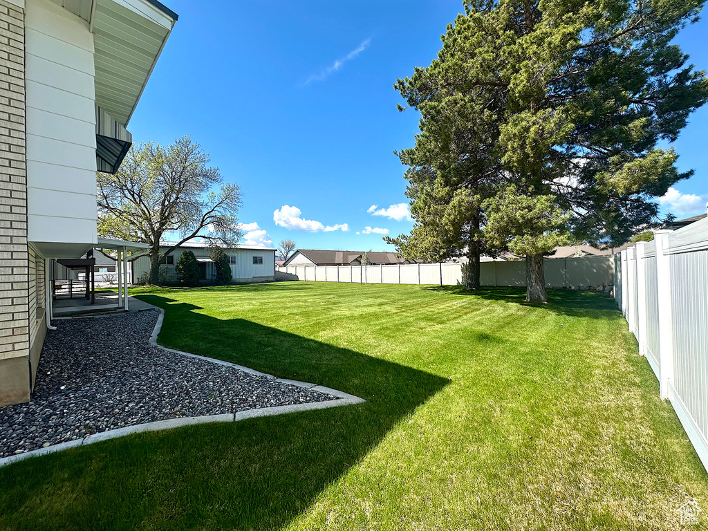 View of yard with a fenced backyard