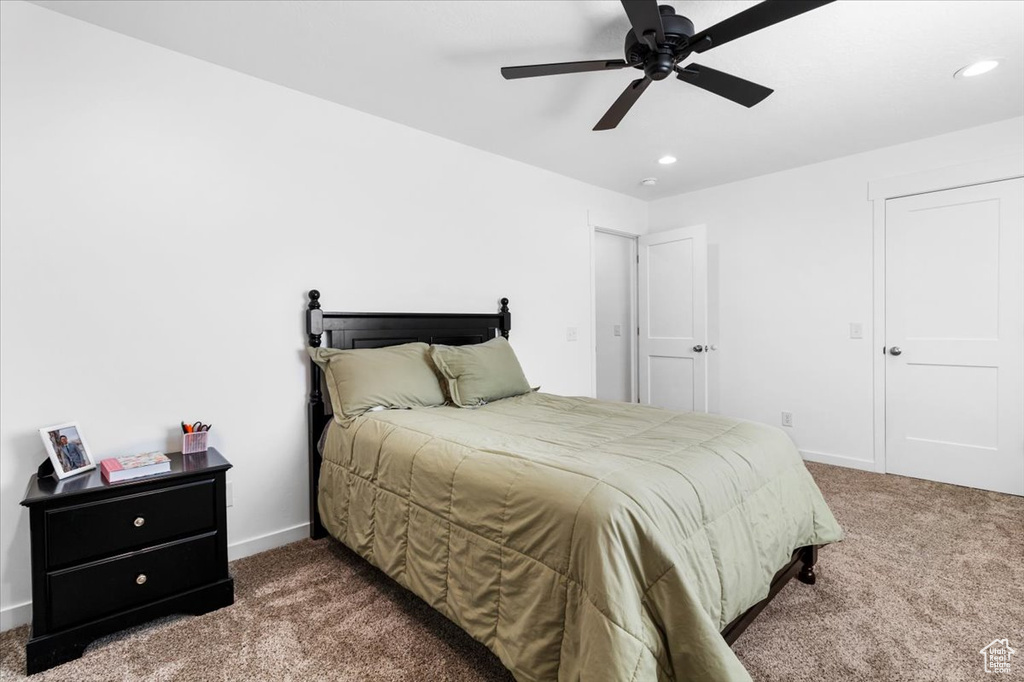 Carpeted bedroom featuring recessed lighting, a ceiling fan, and baseboards