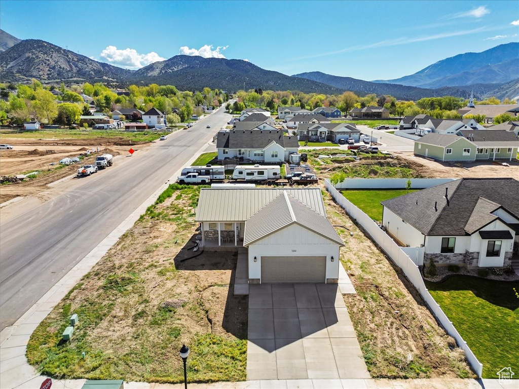 Drone / aerial view featuring a residential view and a mountain view