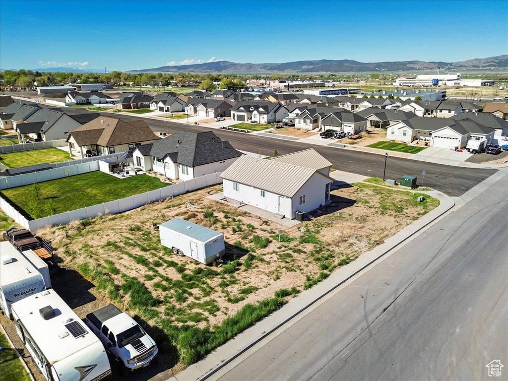 Drone / aerial view featuring a residential view and a mountain view