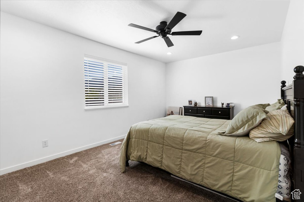 Carpeted bedroom with baseboards, recessed lighting, and ceiling fan