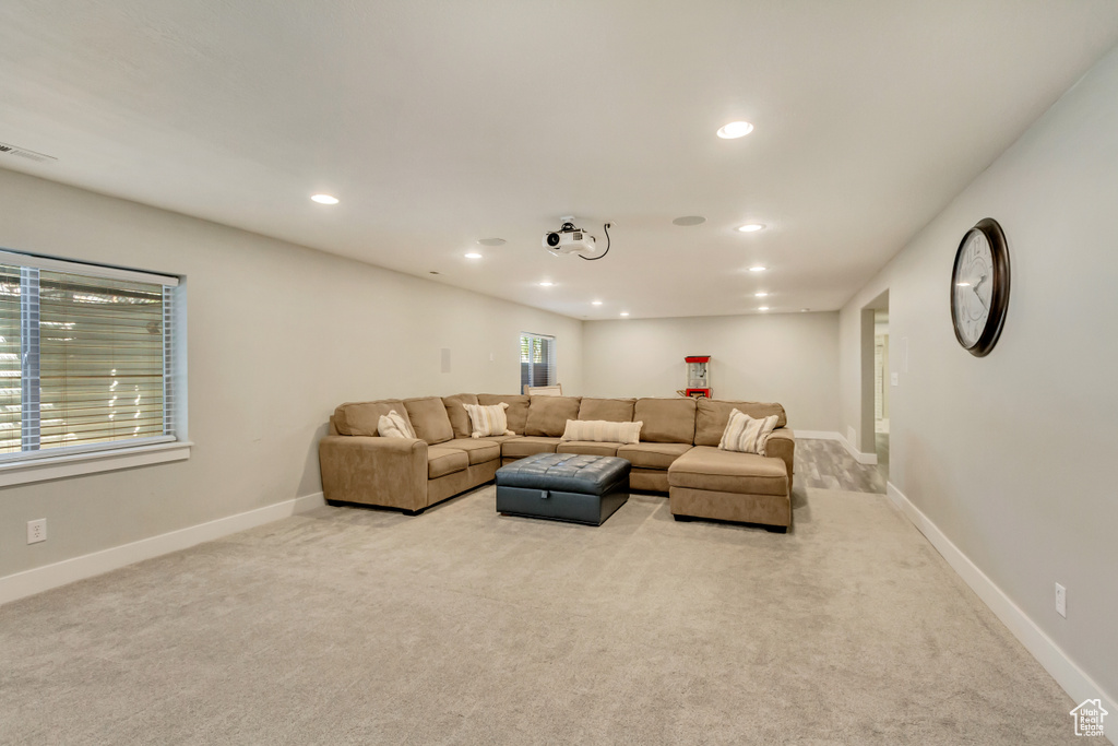 Living room with recessed lighting, carpet, baseboards, and visible vents