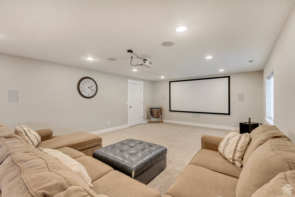 Cinema room with baseboards, recessed lighting, and light colored carpet