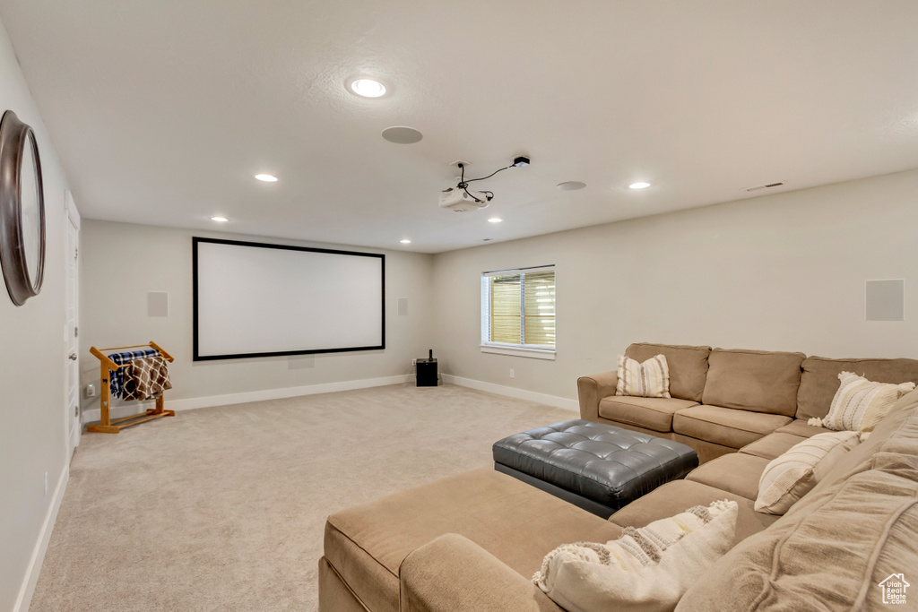 Cinema room with baseboards, recessed lighting, and light colored carpet