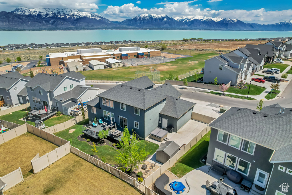 Aerial view featuring a water and mountain view and a residential view