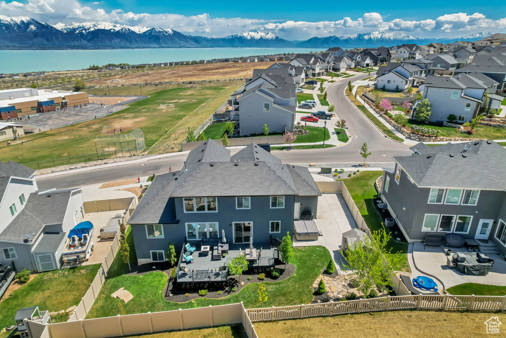 Aerial view featuring a residential view and a water and mountain view