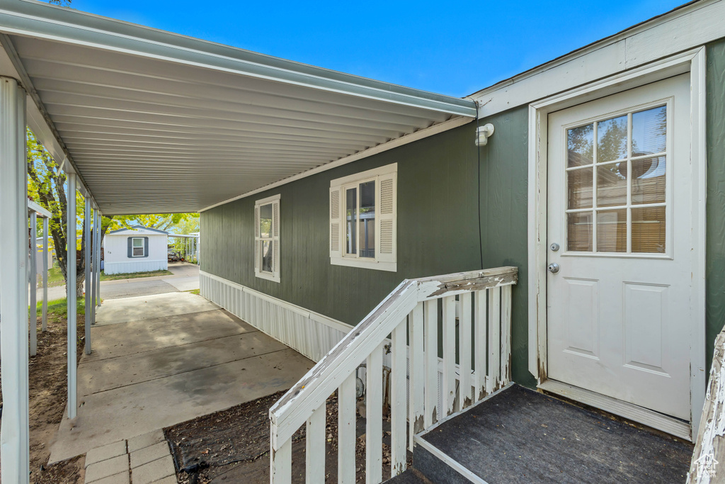 Property entrance with an attached carport