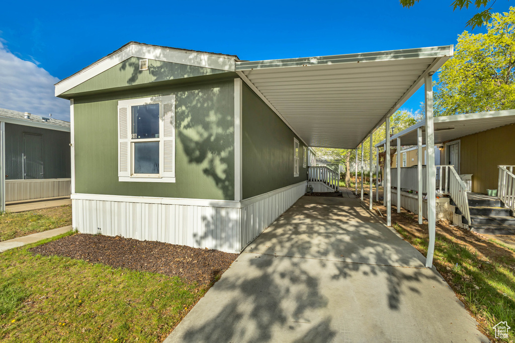 Exterior space featuring an attached carport