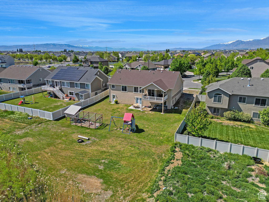 Drone / aerial view featuring a residential view and a mountain view