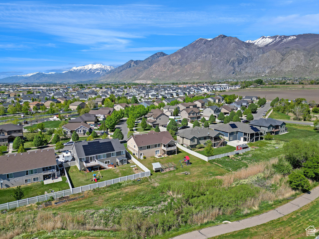 Birds eye view of property with a residential view and a mountain view
