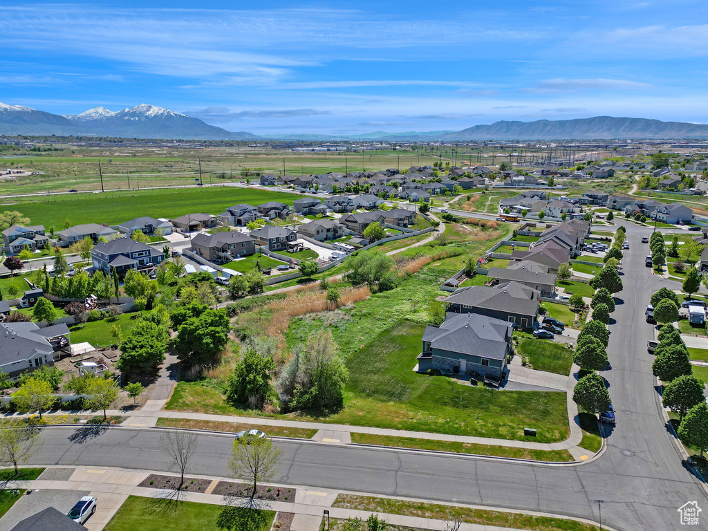 Birds eye view of property with a mountain view and a residential view