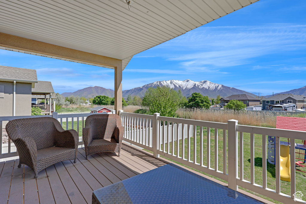 Wooden terrace featuring a mountain view