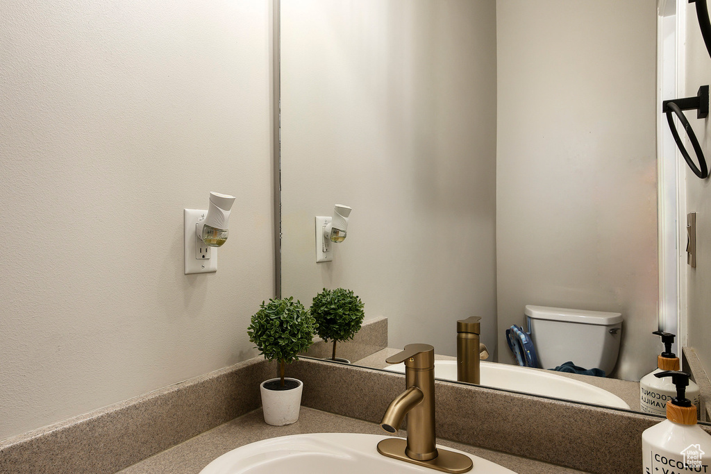 Bathroom with vanity and toilet