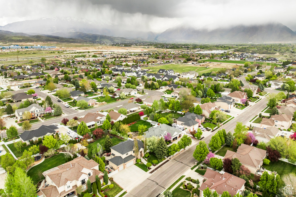 Birds eye view of property with a residential view and a mountain view