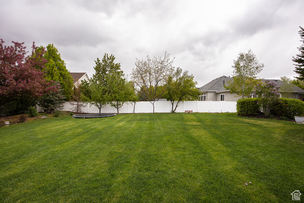 View of yard featuring fence