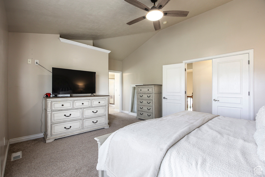 Bedroom featuring carpet flooring, a ceiling fan, baseboards, lofted ceiling, and visible vents