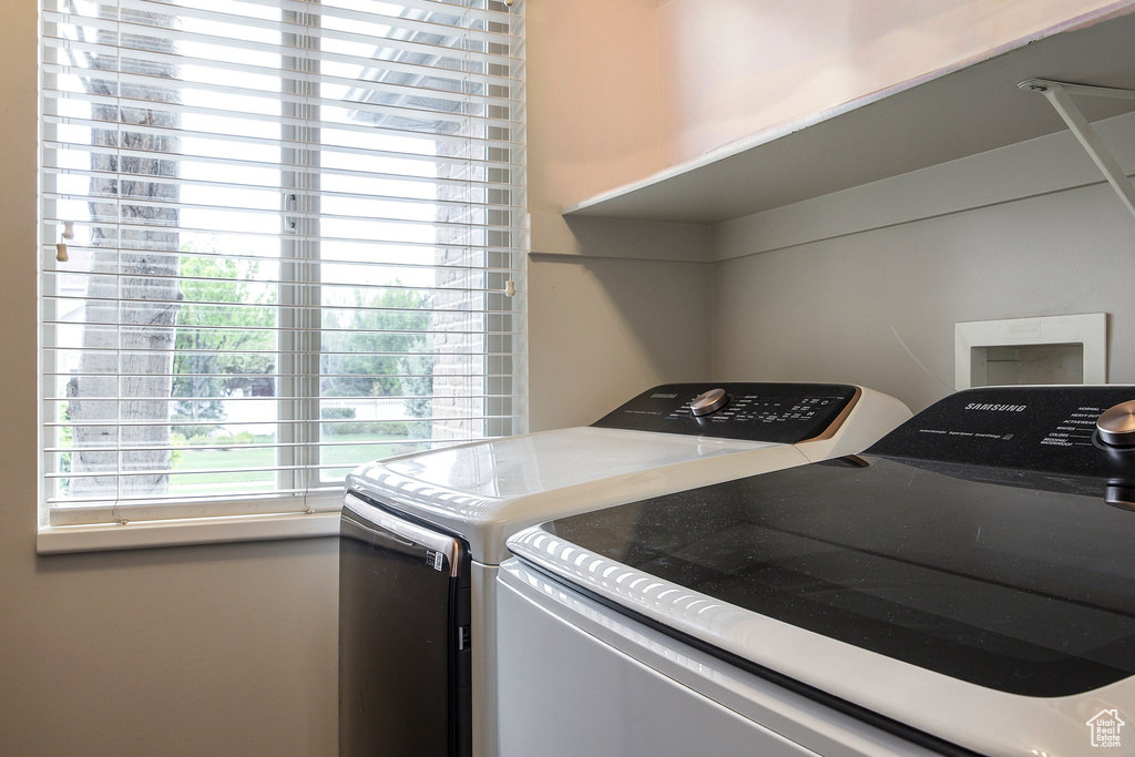 Laundry room with laundry area and washing machine and dryer