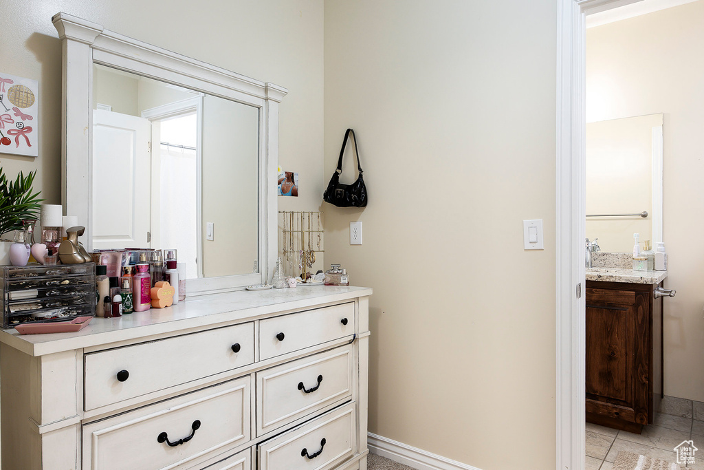 Bathroom featuring vanity and tile patterned floors