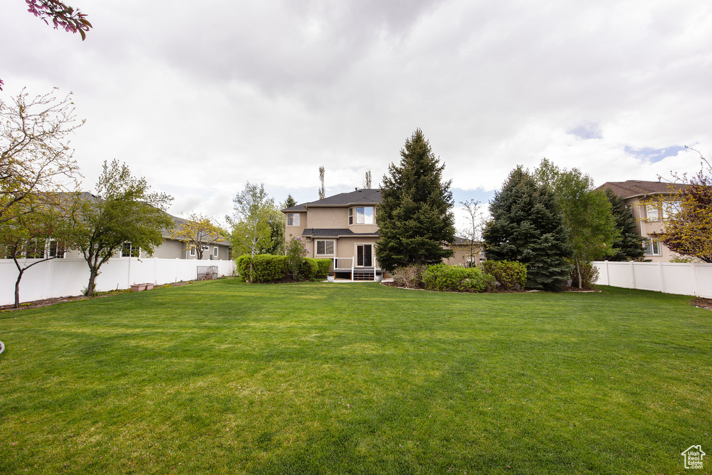 View of yard featuring fence