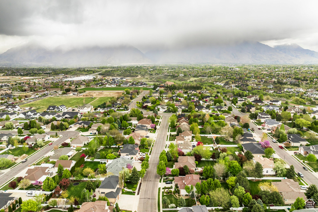 Birds eye view of property featuring a mountain view and a residential view