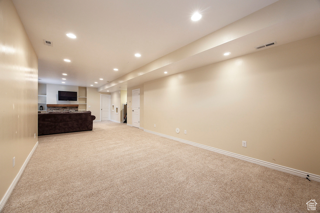 Interior space with carpet floors, recessed lighting, baseboards, and visible vents