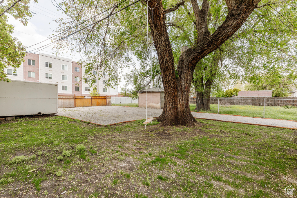 View of yard featuring fence