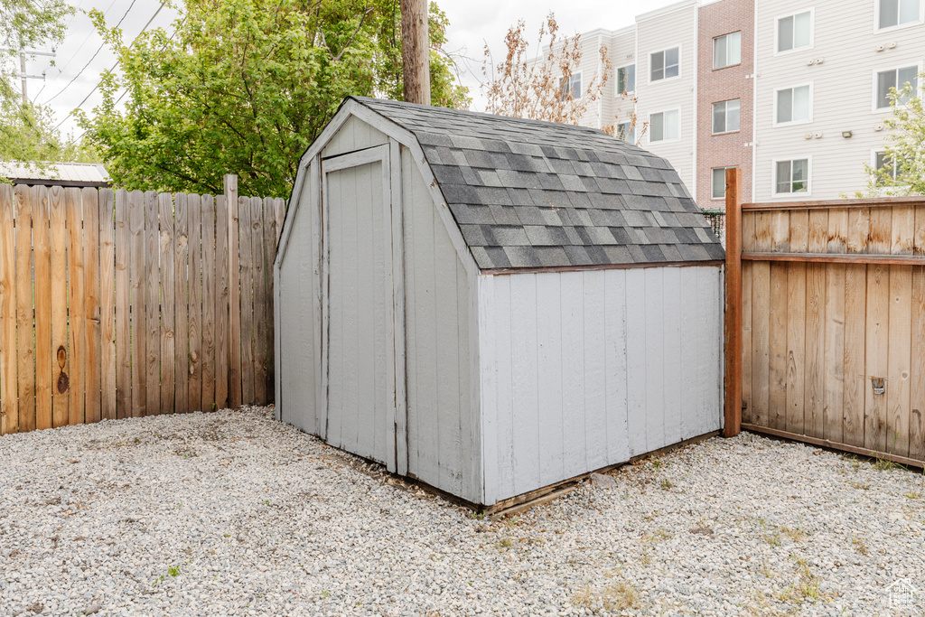 View of shed featuring a fenced backyard