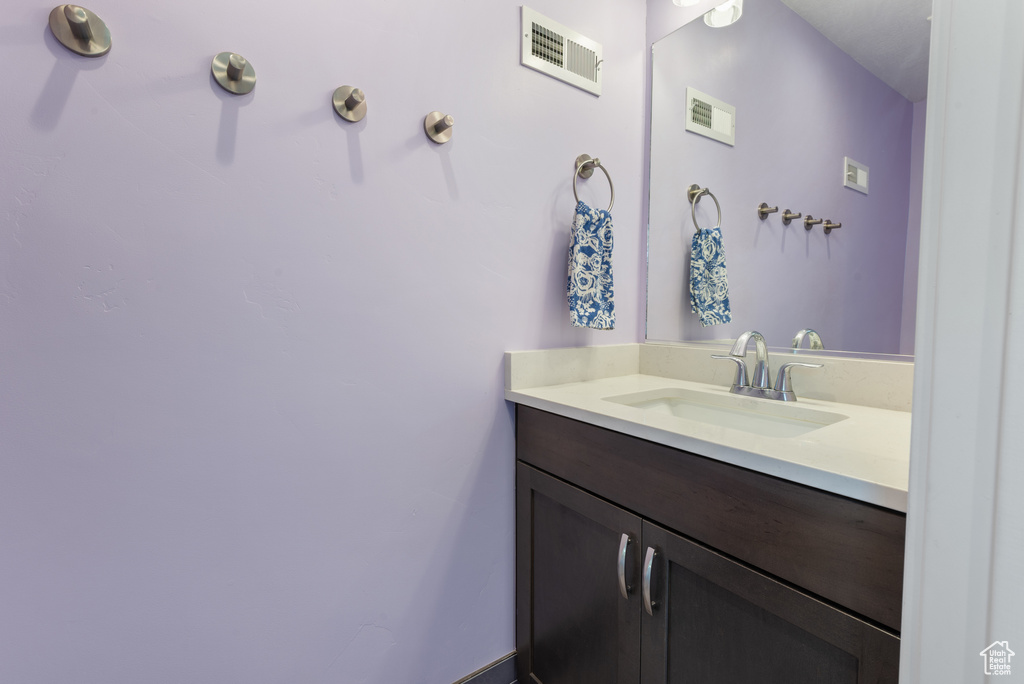 Bathroom with visible vents and vanity