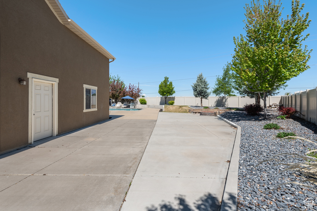 View of patio / terrace with a fenced in pool and a fenced backyard