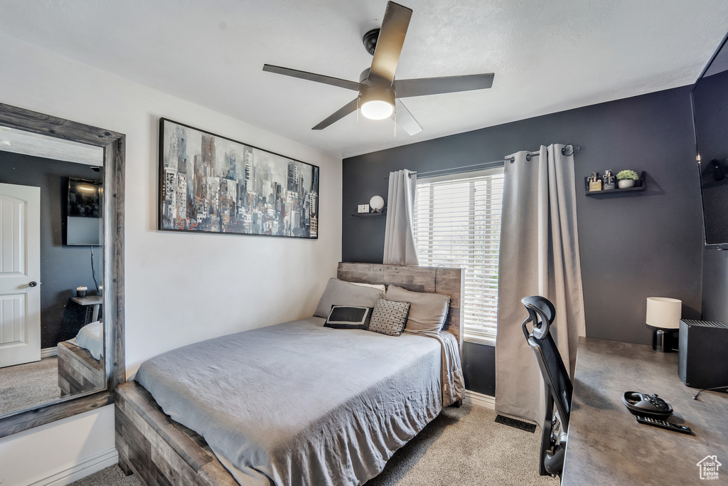 Bedroom with baseboards, a ceiling fan, and carpet flooring