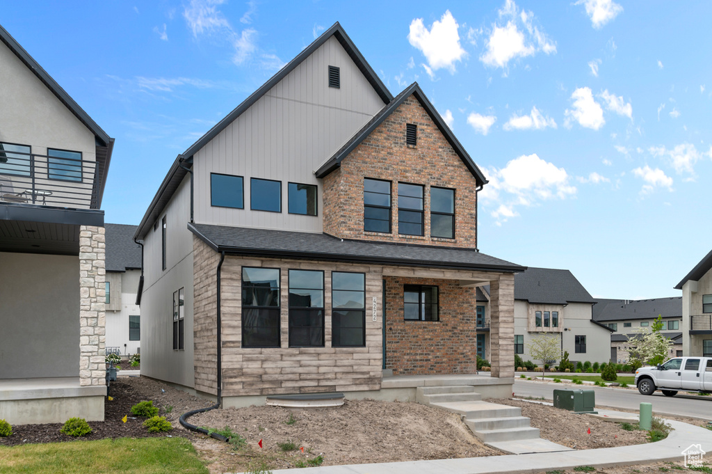 View of front of property with board and batten siding