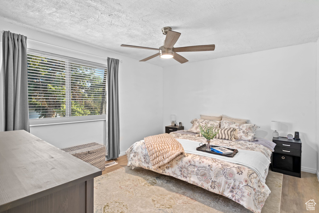 Bedroom featuring ceiling fan and light wood finished floors