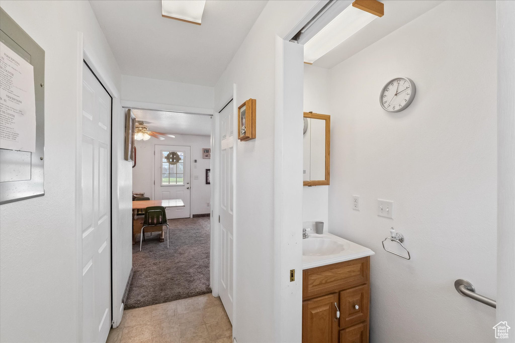 Bathroom with vanity and ceiling fan