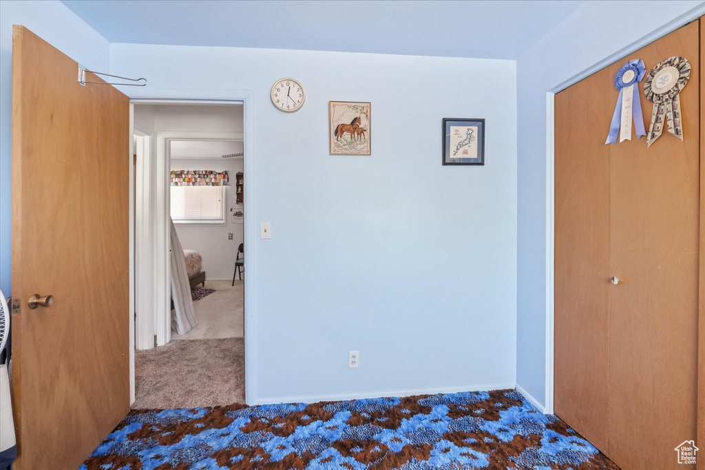 Unfurnished bedroom featuring carpet floors