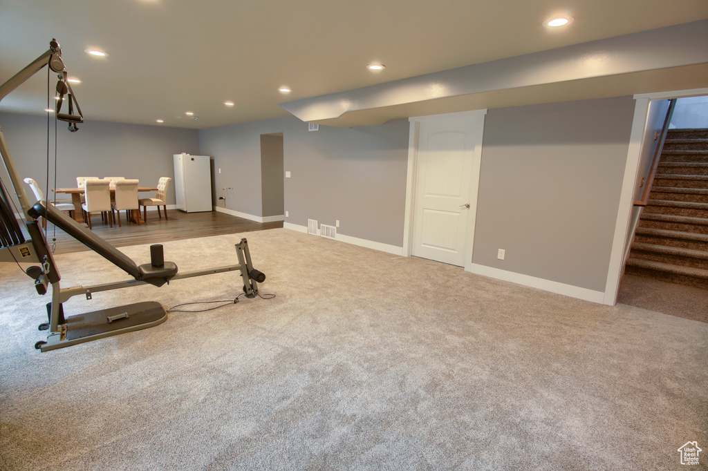 Workout area featuring baseboards, carpet, recessed lighting, and visible vents