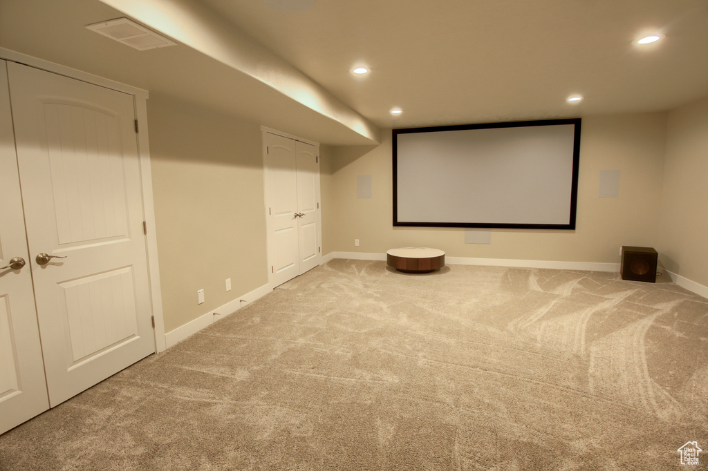 Cinema room with visible vents, recessed lighting, baseboards, and carpet floors