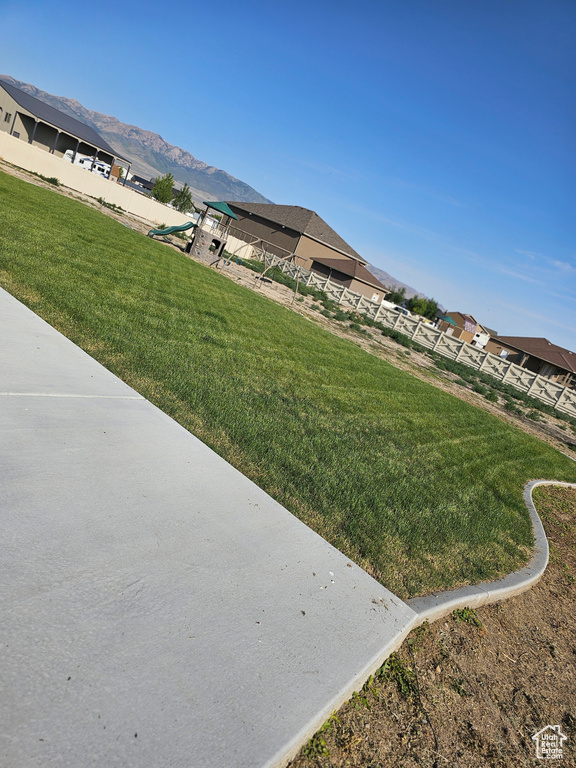 View of green lawn with a mountain view
