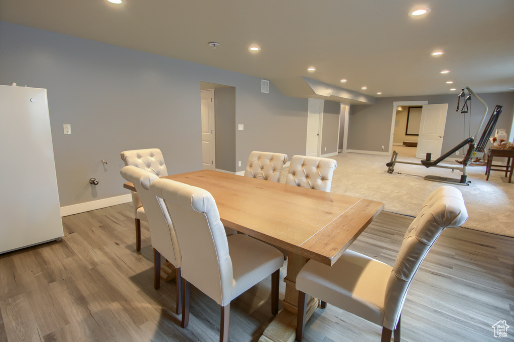 Dining space featuring recessed lighting, baseboards, and light wood-style flooring