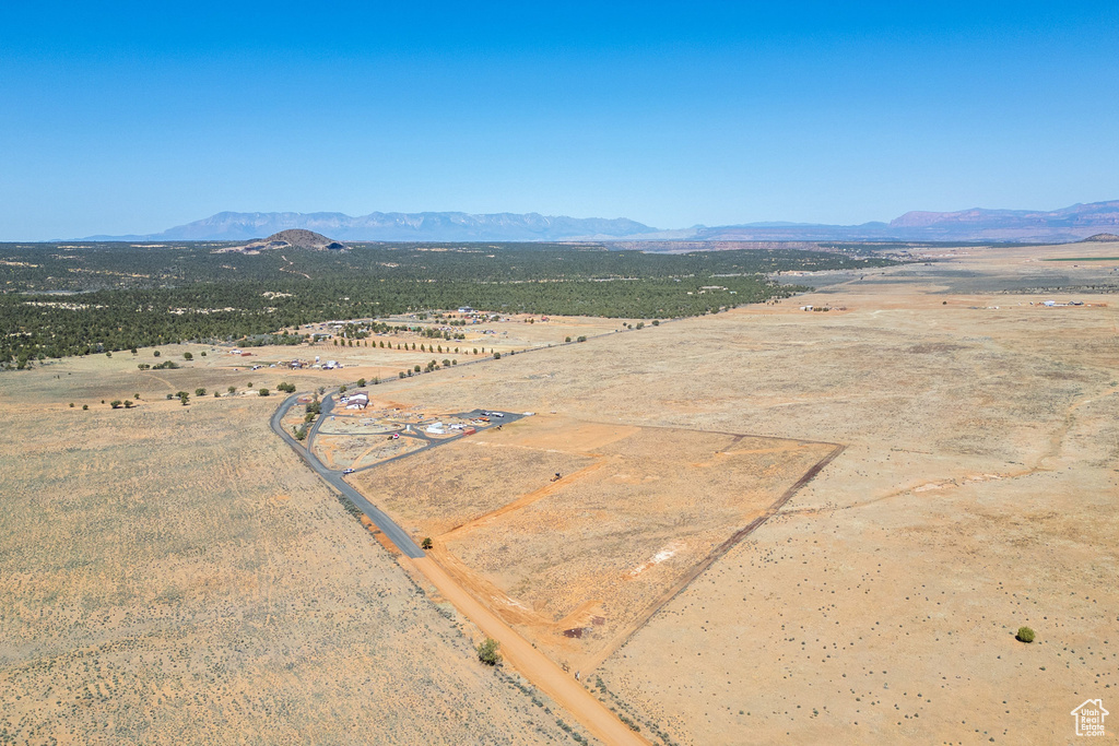 Birds eye view of property with a desert view, a mountain view, and a rural view