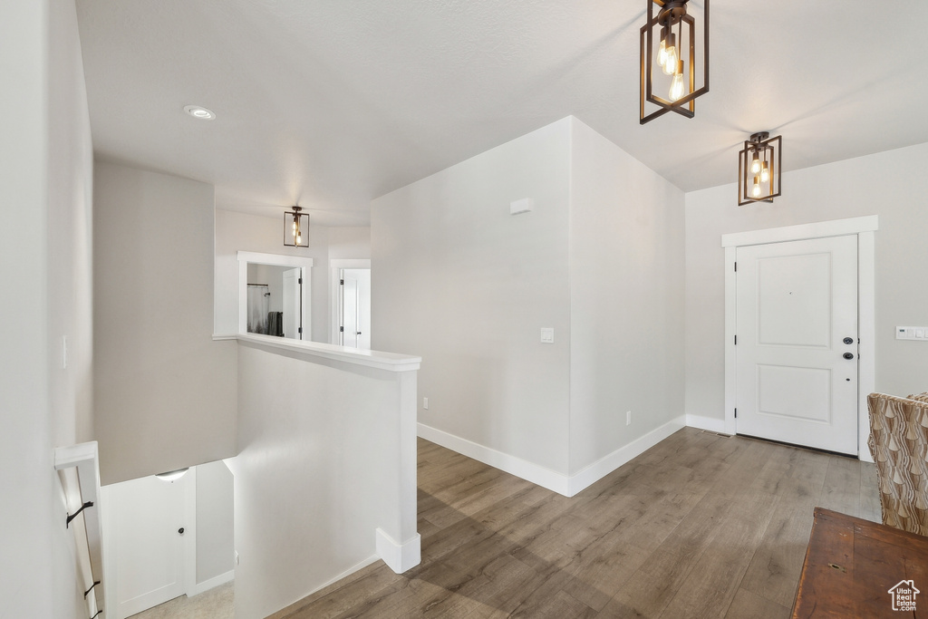 Entryway featuring baseboards and wood finished floors