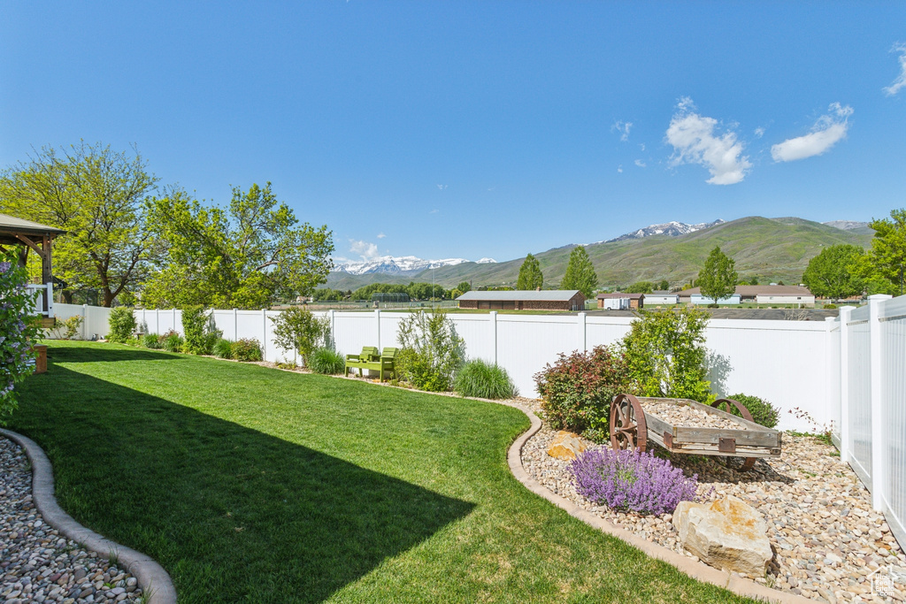 View of yard with a mountain view