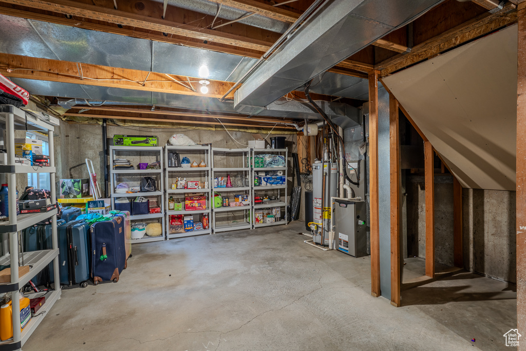 Unfinished basement with gas water heater
