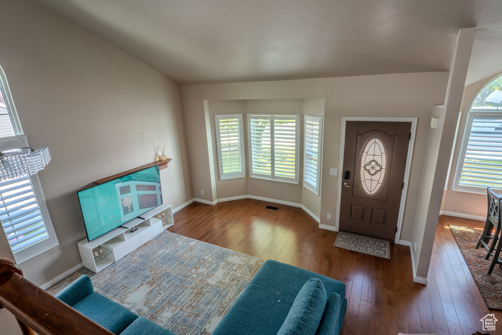 Entryway featuring plenty of natural light, wood-type flooring, baseboards, and visible vents