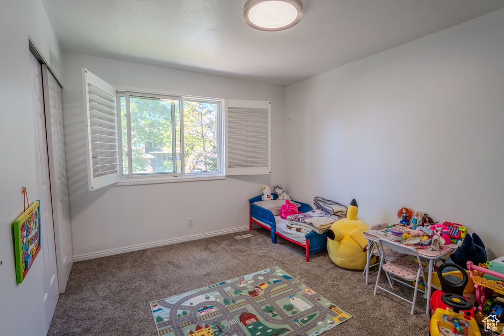 Playroom with carpet floors and baseboards