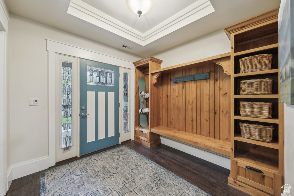 Mudroom with wood finished floors and visible vents